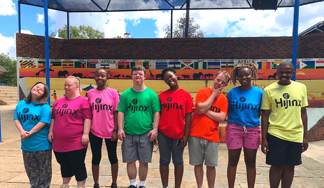 http://Hijinx%20actors%20and%20young%20people%20from%20Lesotho%20stand%20smiling%20together