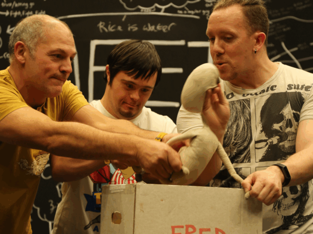 Ben, Gareth and Nick putting Fred into his box.