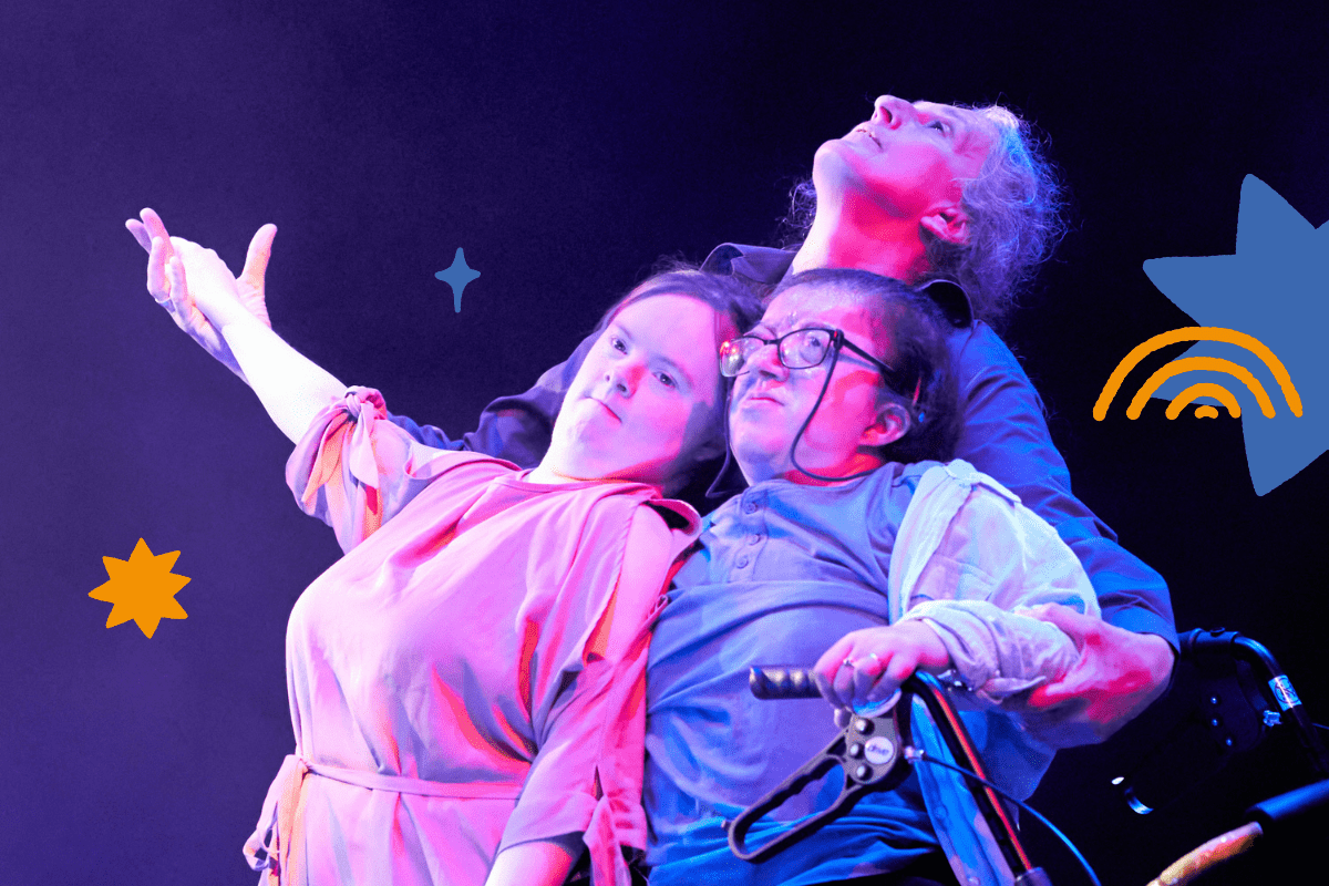 http://Three%20diverse%20dancers%20in%20pink%20and%20blue%20lighting%20pose%20close%20together.